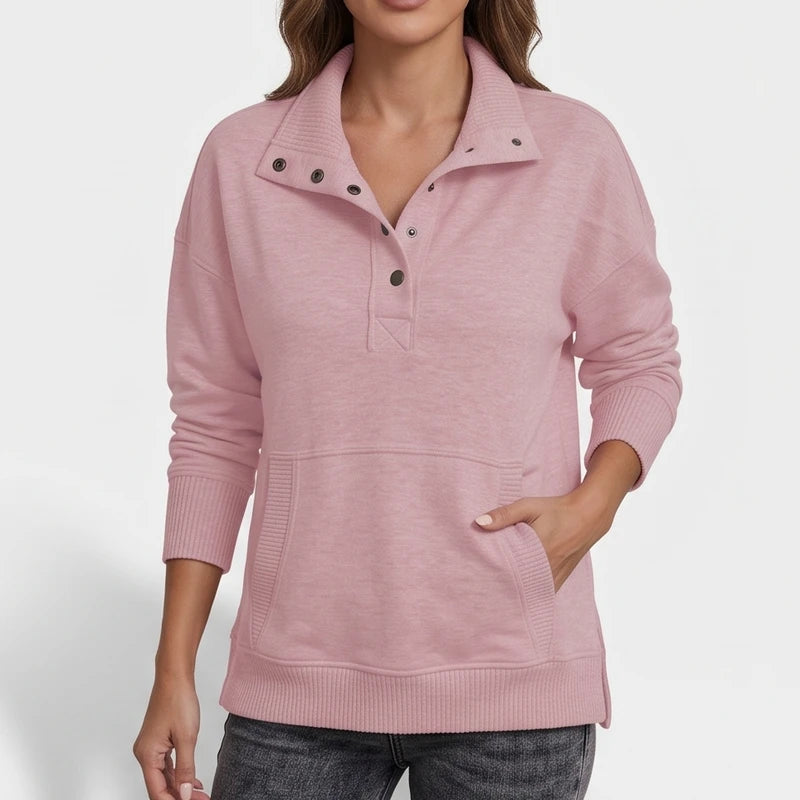 Pink pullover on an off-gray studio background