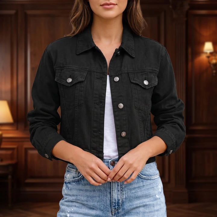 Black denim jacket in a dark wood interior
