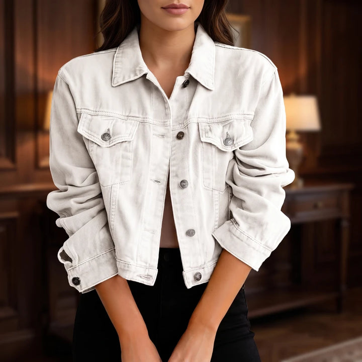 White denim jacket in a dark wood interior