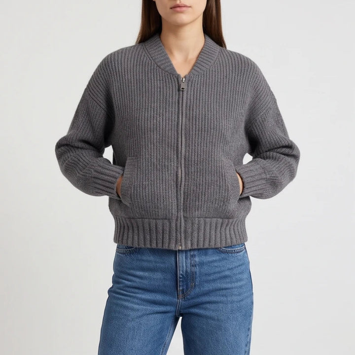 Gray knit cardigan on an off-gray studio background