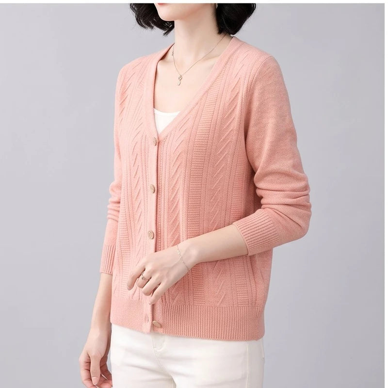 Model wearing Pink knitted cardigan in a studio - 2
