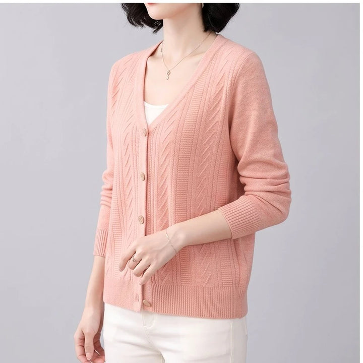 Model wearing Pink knitted cardigan in a studio - 2