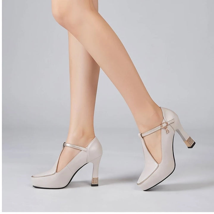 Model wearing White pumps in a studio