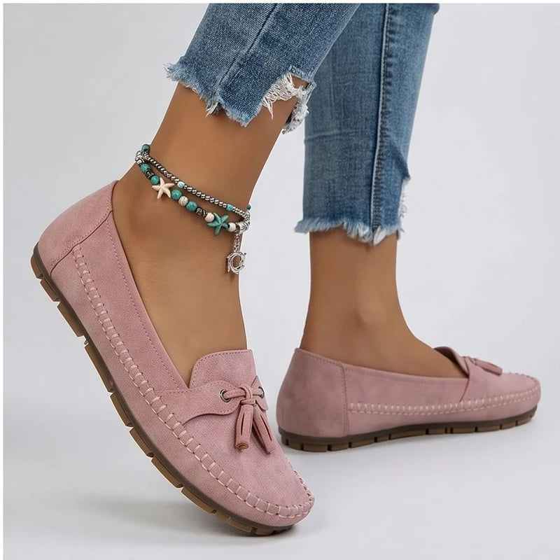 Model wearing Pink loafers in a studio - 2