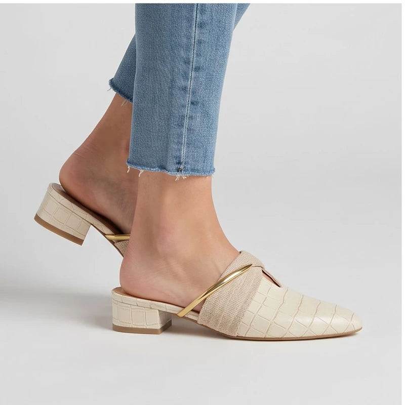 Model wearing Ivory Cream mules in a studio - 2