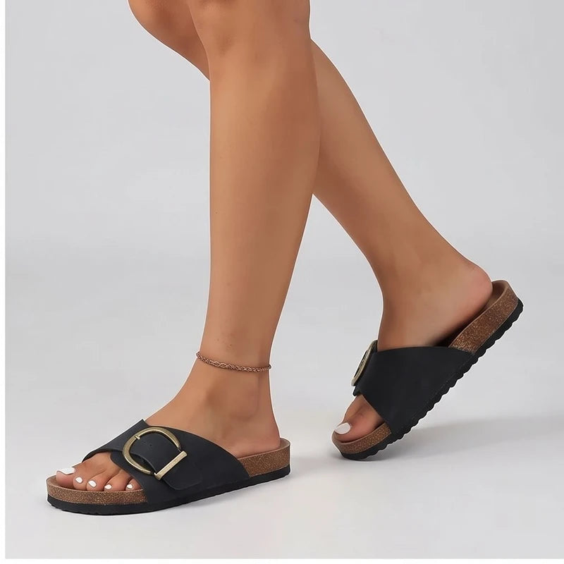 Model wearing Black sandals in a studio