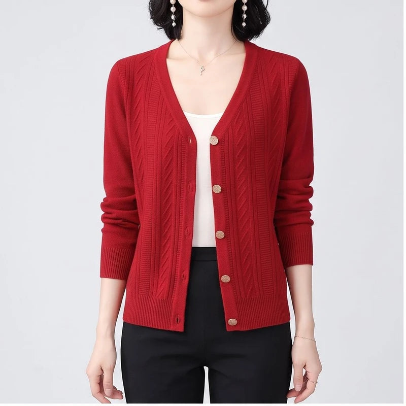 Model wearing Red knitted cardigan in a studio