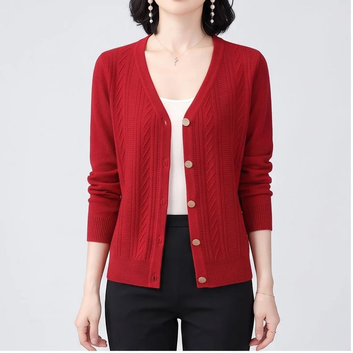 Model wearing Red knitted cardigan in a studio
