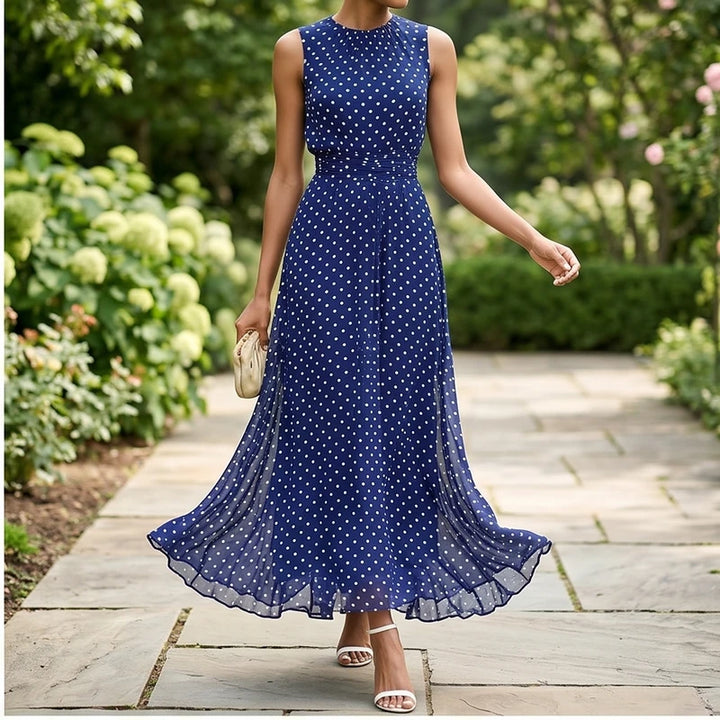 Model wearing Blue Sleeveless Polka Dot Chiffon Maxi Dress with Ruffle Hem and Flowing A Line Silhouette for Summer Parties outdoors - 2