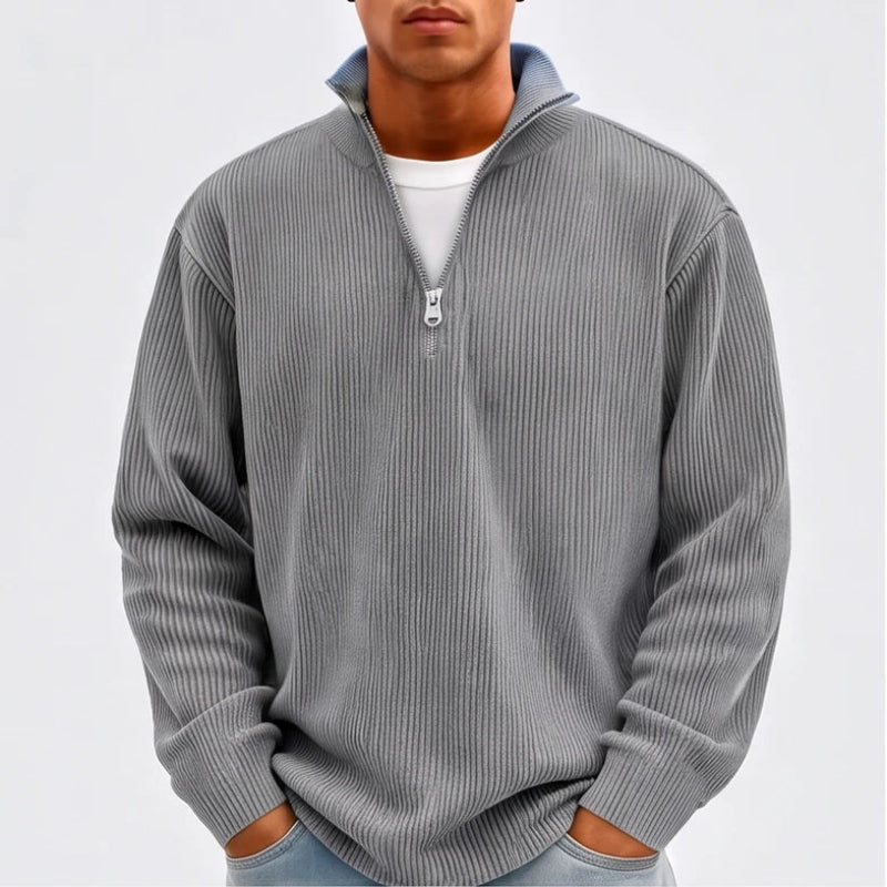 Model wearing Gray corduroy pullover in a studio