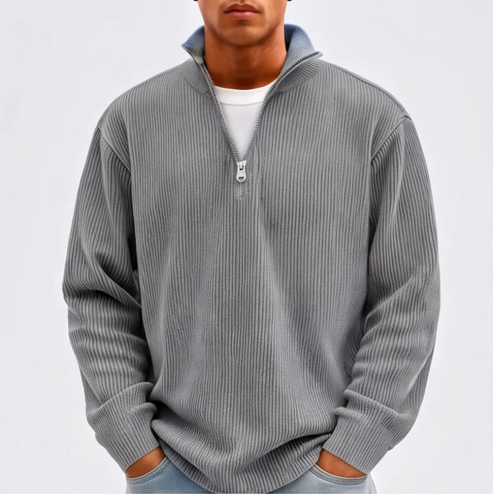 Model wearing Gray corduroy pullover in a studio