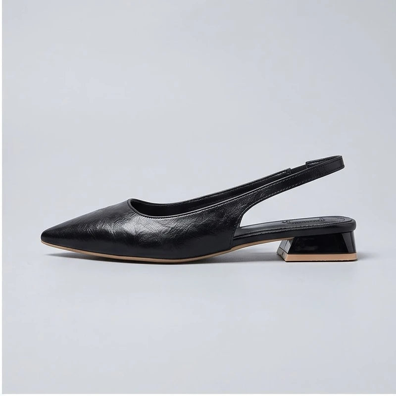 Black leather flats in a studio background - 2