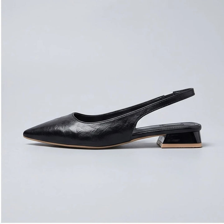 Black leather flats in a studio background - 2