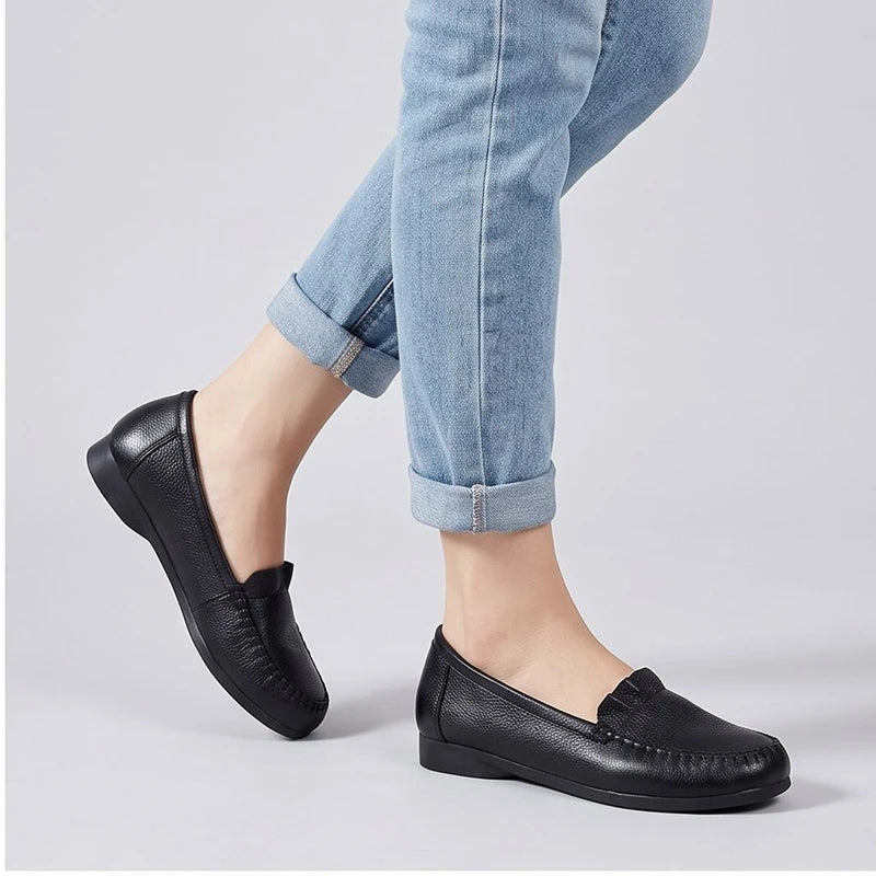 Model wearing Black leather loafers in a studio - 2