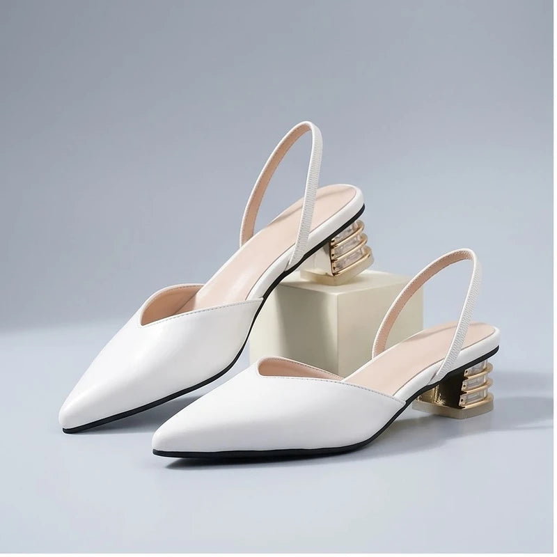 White sandals in a studio background