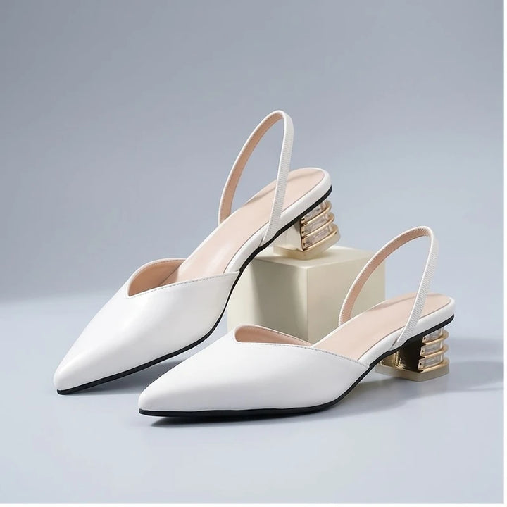 White sandals in a studio background