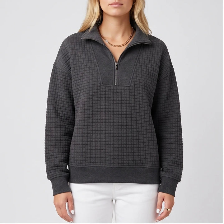 Model wearing Black knit pullover in a studio
