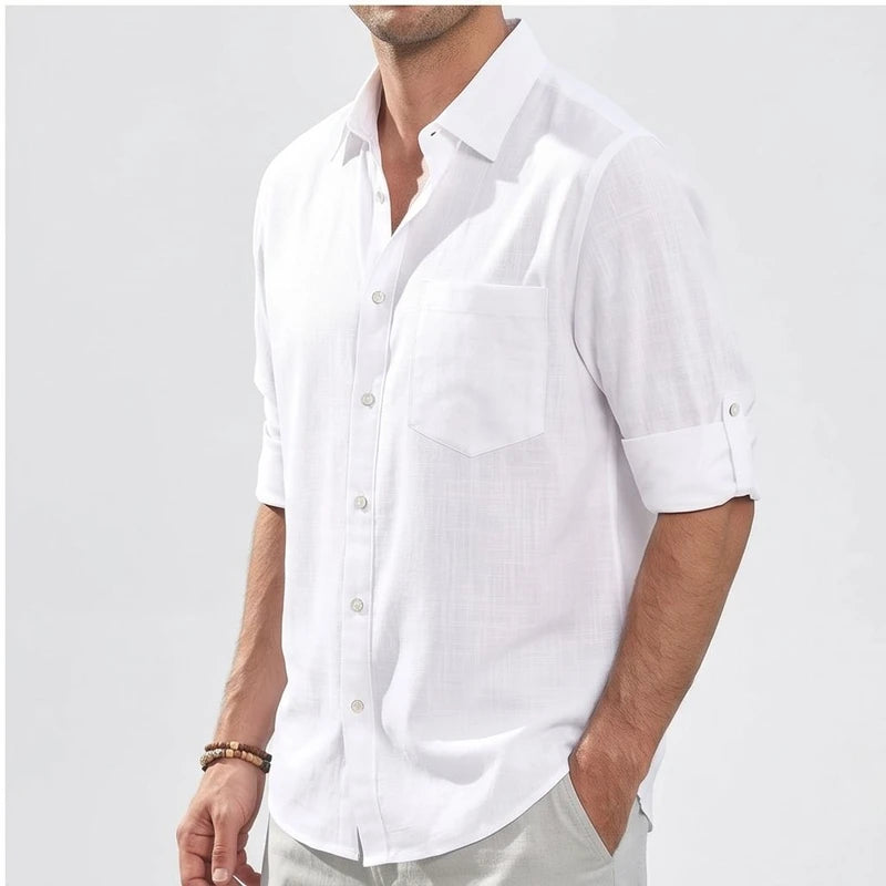 Men's white linen button-up shirt with a chest pocket and rolled sleeves.
