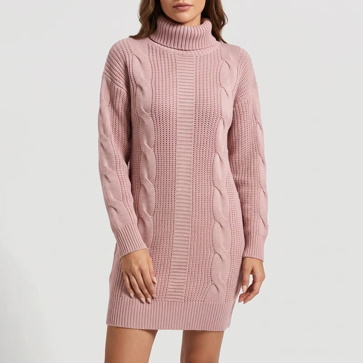 Pink knit dress on an off-gray studio background