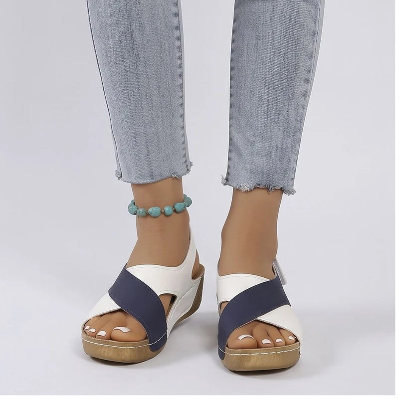 Model wearing Blue sandals in a studio