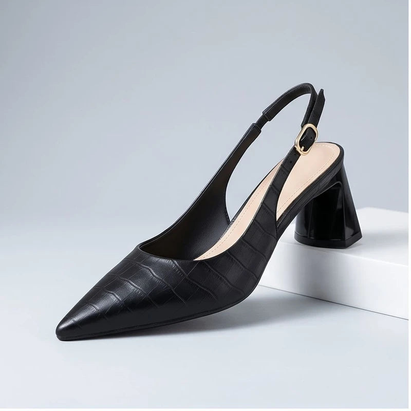 Black heel in a studio background