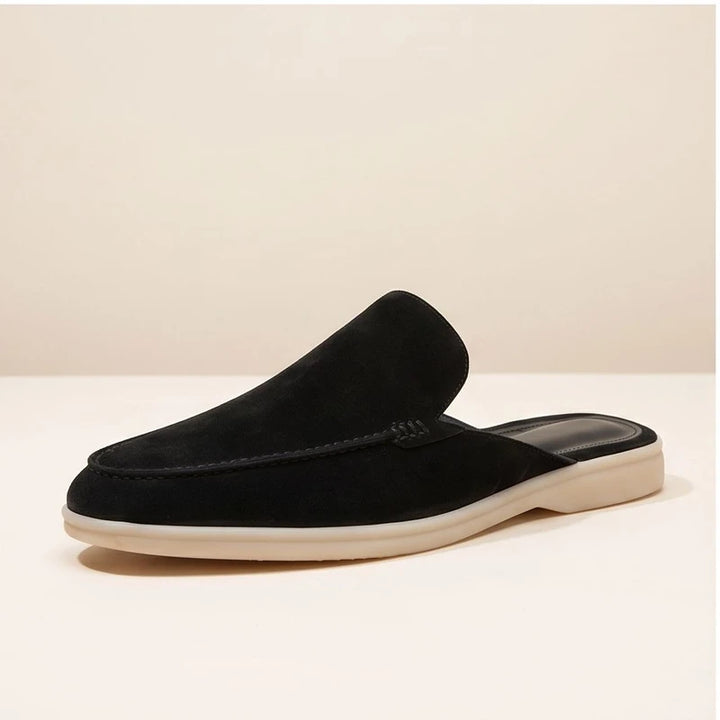 Black suede mules in a studio background - 3