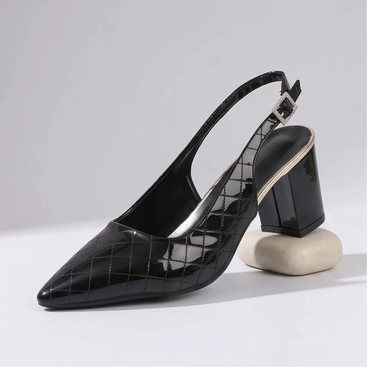Black heel in a studio background