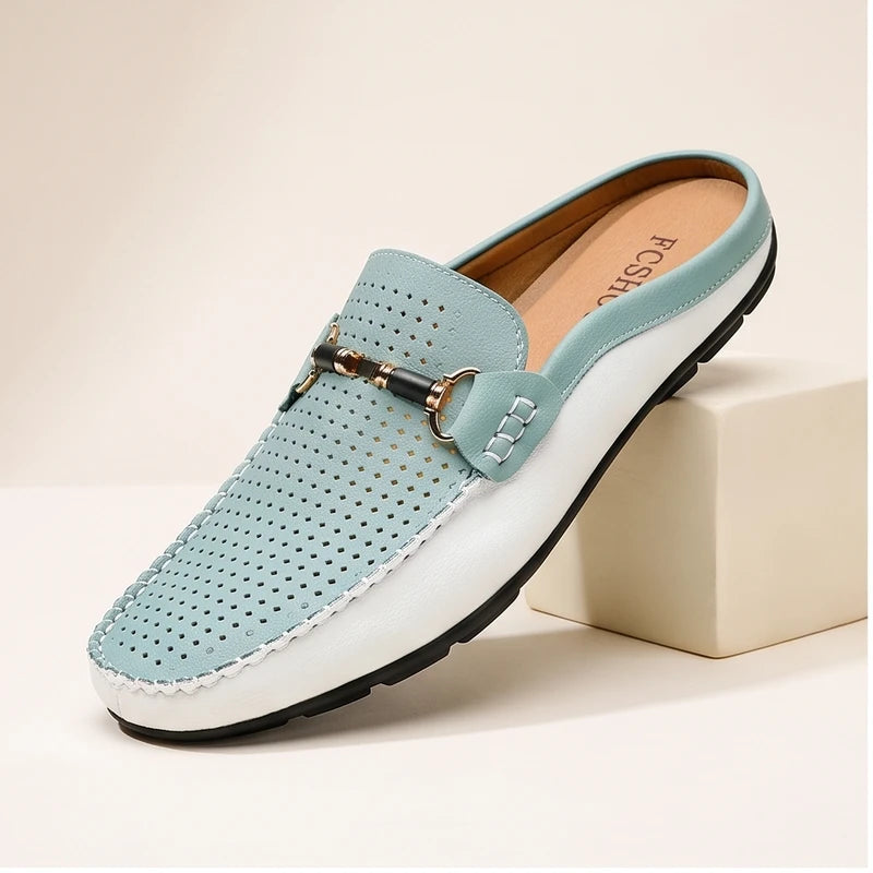 Blue leather loafers in a studio background