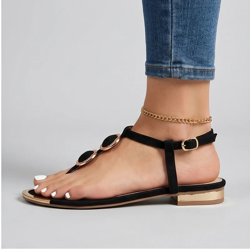 Model wearing Black Harlow T-Strap Flat Sandals in studio - 2