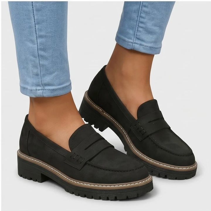 Model wearing Black Brynn Suede Penny Loafers  [needs new images] in studio - 2
