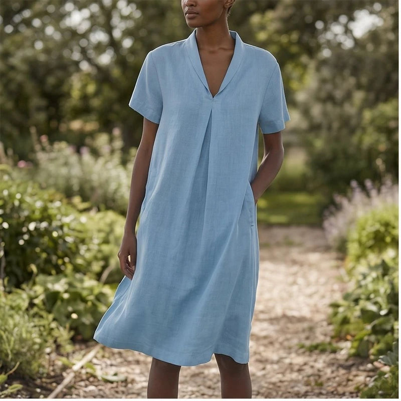 Model wearing Blue Women's Short-sleeved Cotton and Linen Dress V-neck Loose Large Size Casual Vacation Street Long Dress with Pockets outdoors