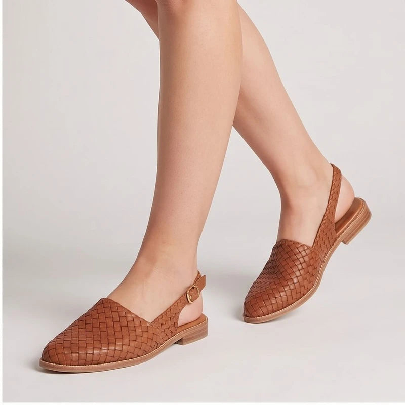 Model wearing Beige woven loafers in a studio