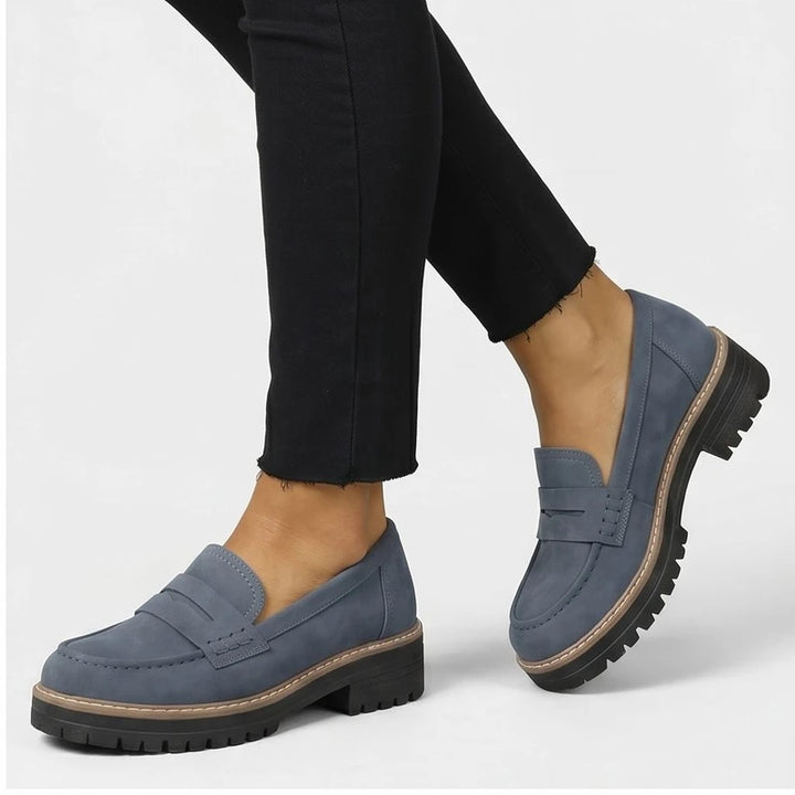 Model wearing Blue Brynn Suede Penny Loafers  [needs new images] in studio