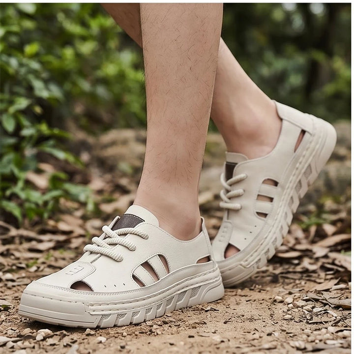 Model wearing Beige New Arrival Men Leather Sandals Slip on Beach Shoes Breathable Summer Casual Shoe Light Sandales Non Slip Male Wading Aqua Shoes outdoors - 2