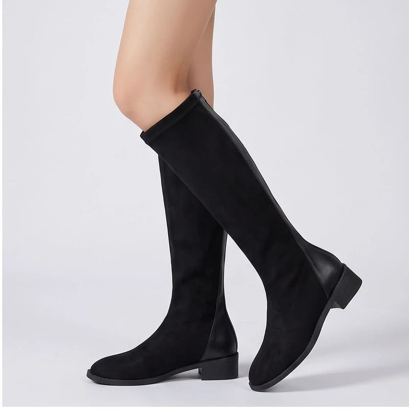 Model wearing Black shoes in a studio