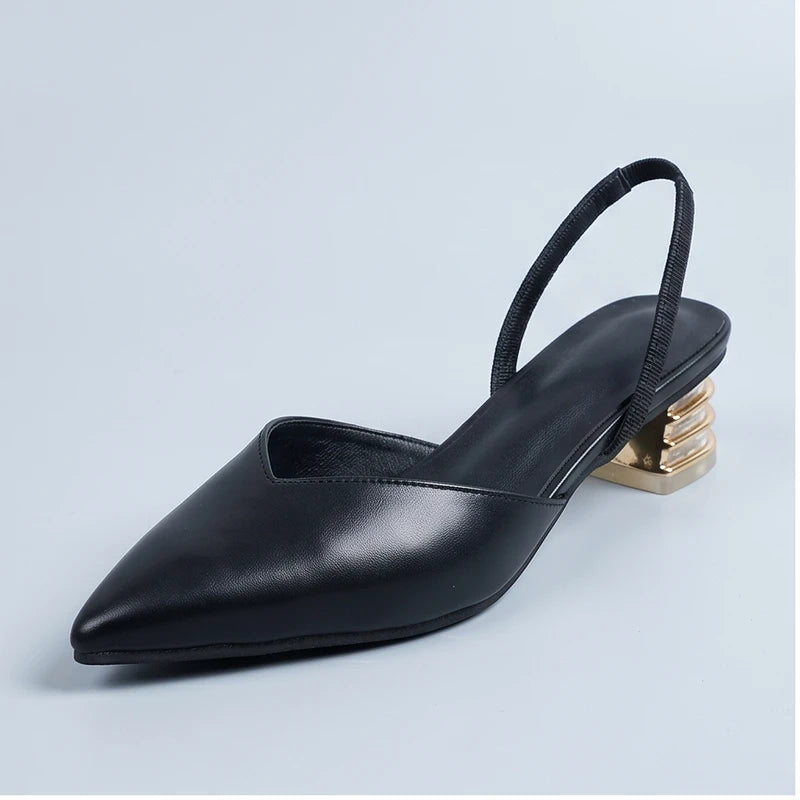 Black sandals in a studio background