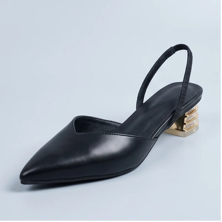 Black sandals in a studio background
