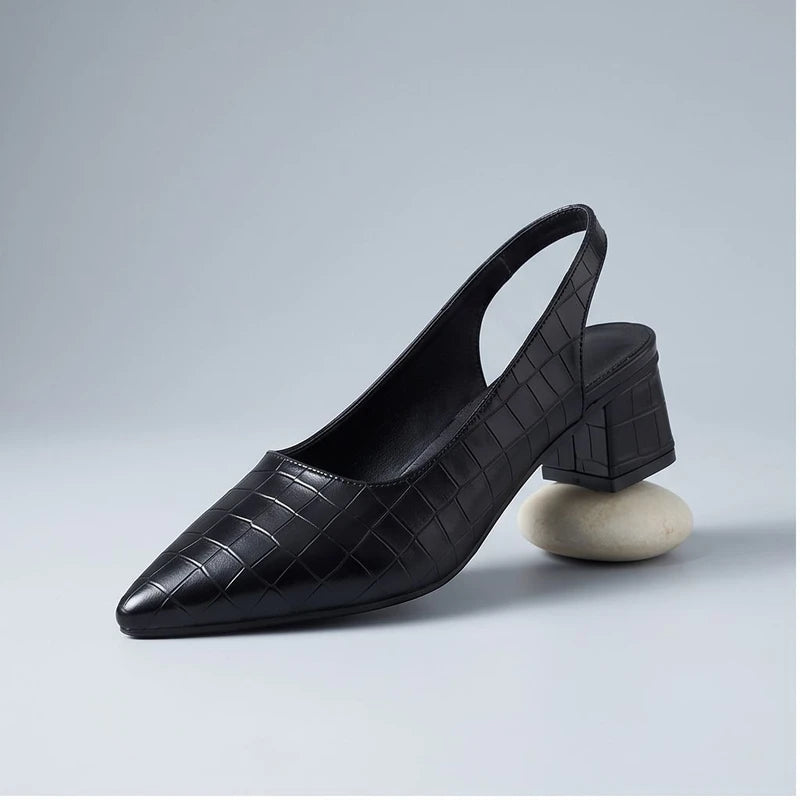 Black heels in a studio background