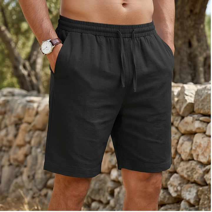 Model wearing Black New Solid Linen Short Lightweight Gym Man Casual Pants Oversize Beach Hawaiian Baggy Pants Men Jogging Cotton Large Short Homme outdoors