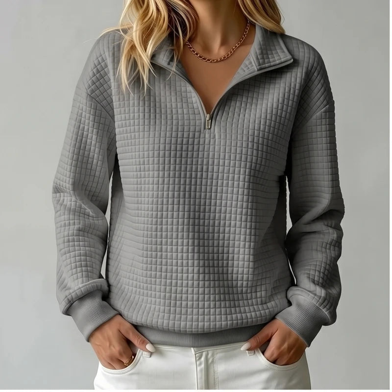 Model wearing Gray knit pullover in a studio