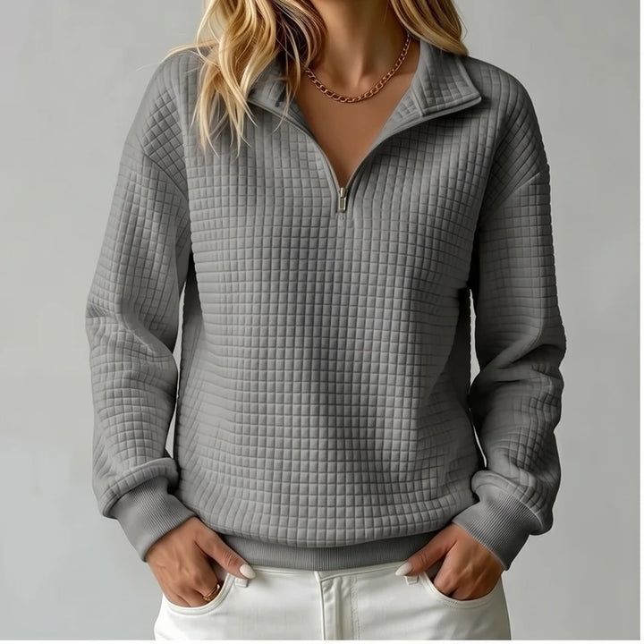 Model wearing Gray knit pullover in a studio