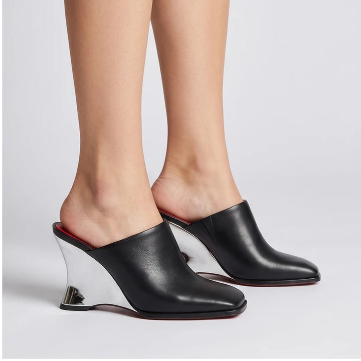 Model wearing Black Olympia Genuine Cowhide Leather Heeled Mules in studio - 2