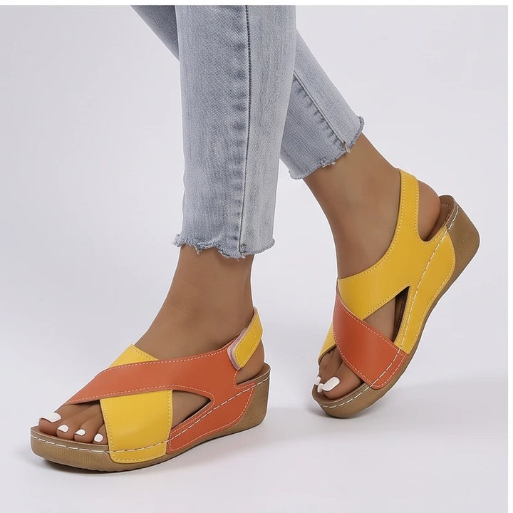 Model wearing Orange sandals in a studio - 2