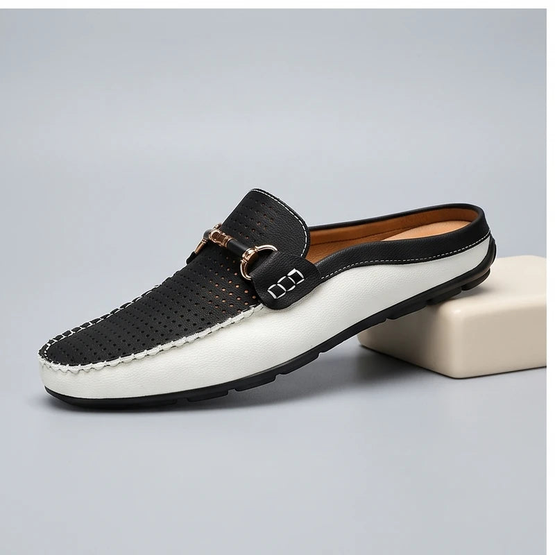 Black leather loafers in a studio background - 2