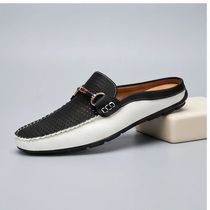 Black leather loafers in a studio background - 2