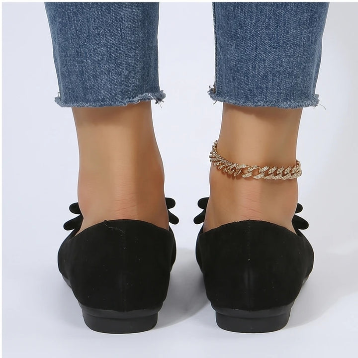 Model wearing Black Briony Suede Bow Flats in studio - 4