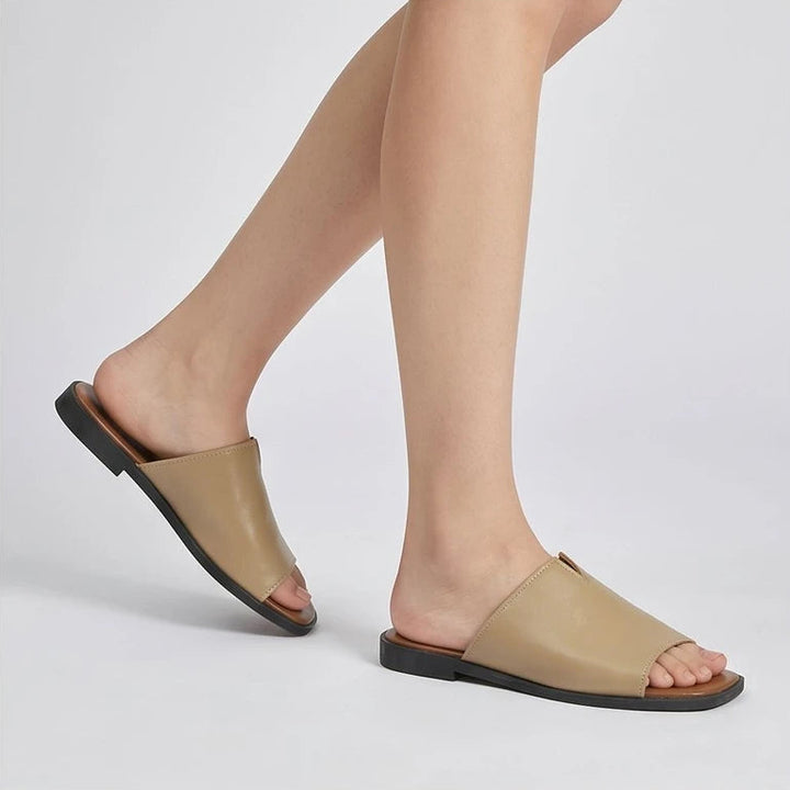 Model wearing Khaki Shiny Metallic Flat Slides for Women Square Toe Open Toe Lightweight Comfortable Summer Beach Casual Daily Walking Shoes in studio - 2