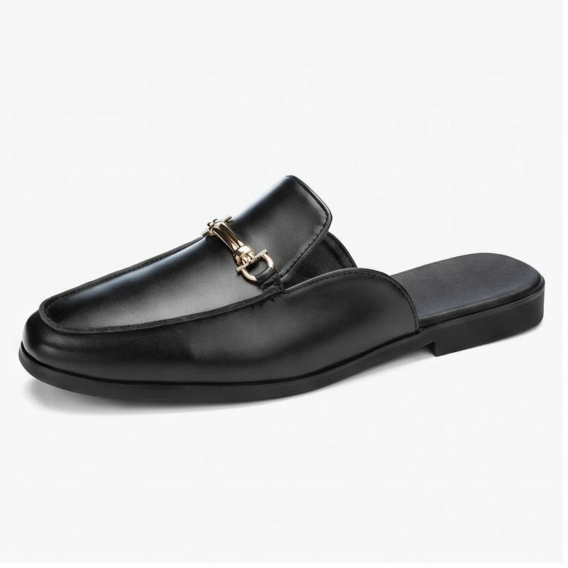 Black leather loafers on a white background
