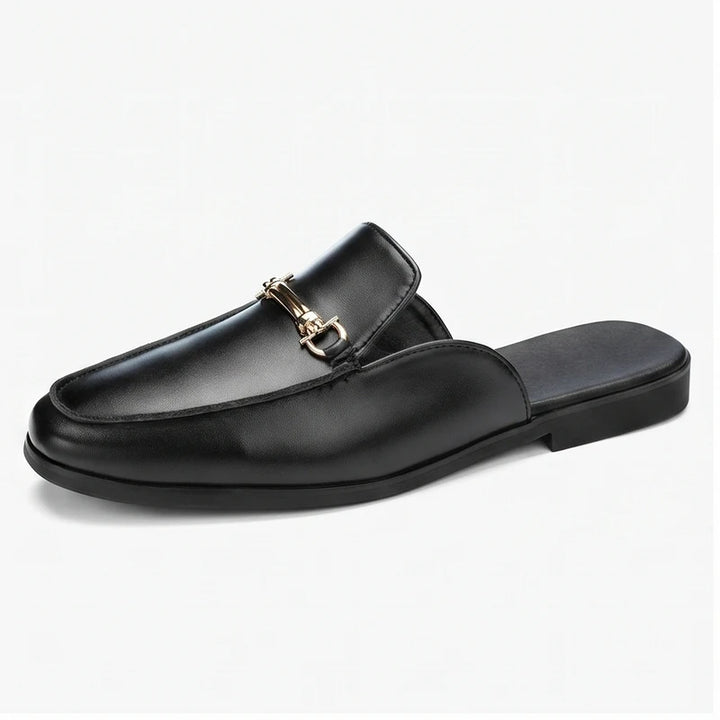 Black leather loafers on a white background