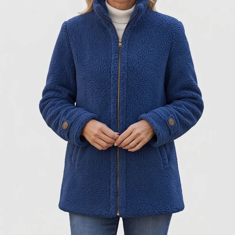 Blue fleece jacket on an off-gray studio background - 2